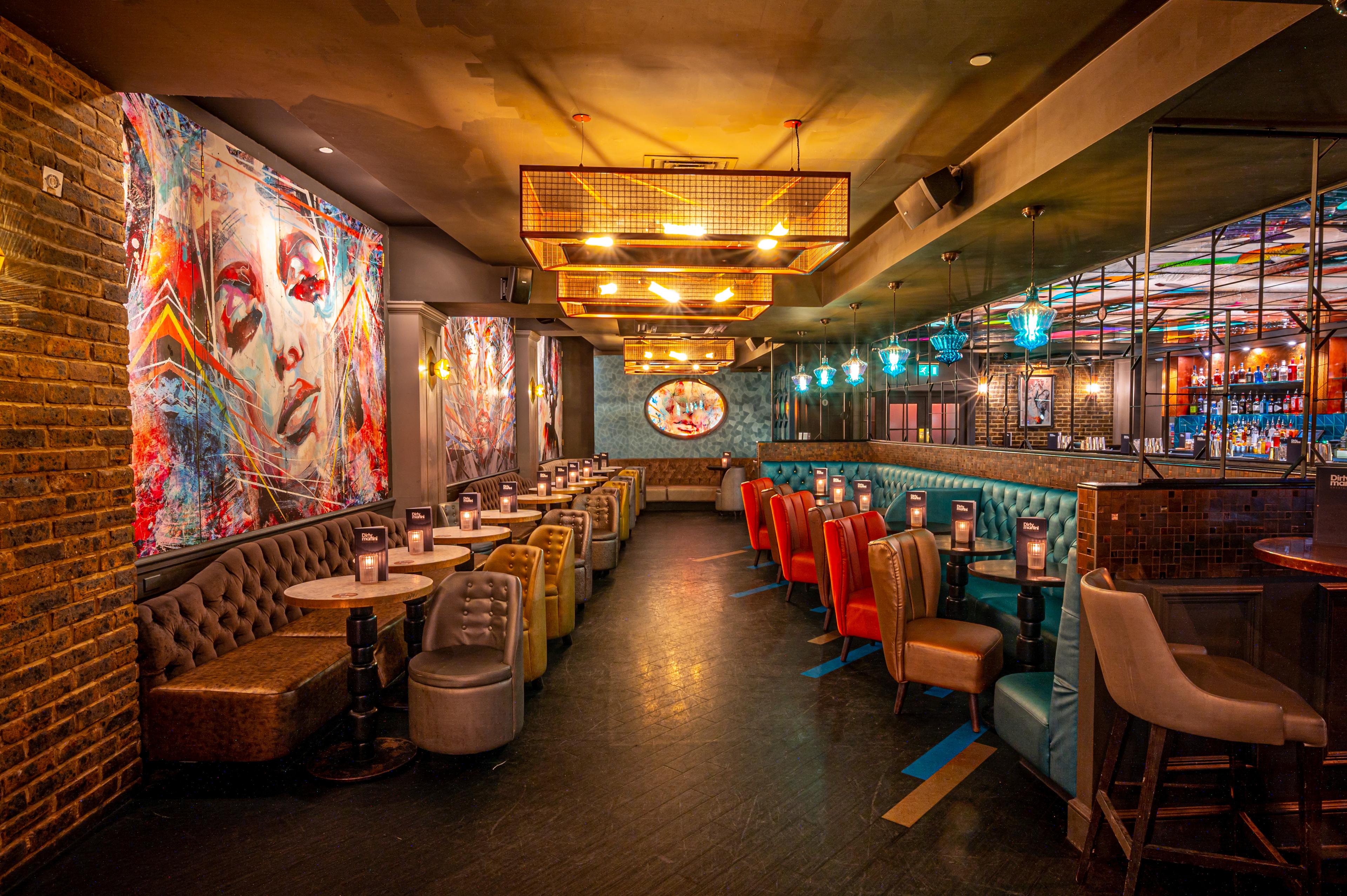 The VIP area of Dirty Martini in Bishopsgate with benches, tables and chairs